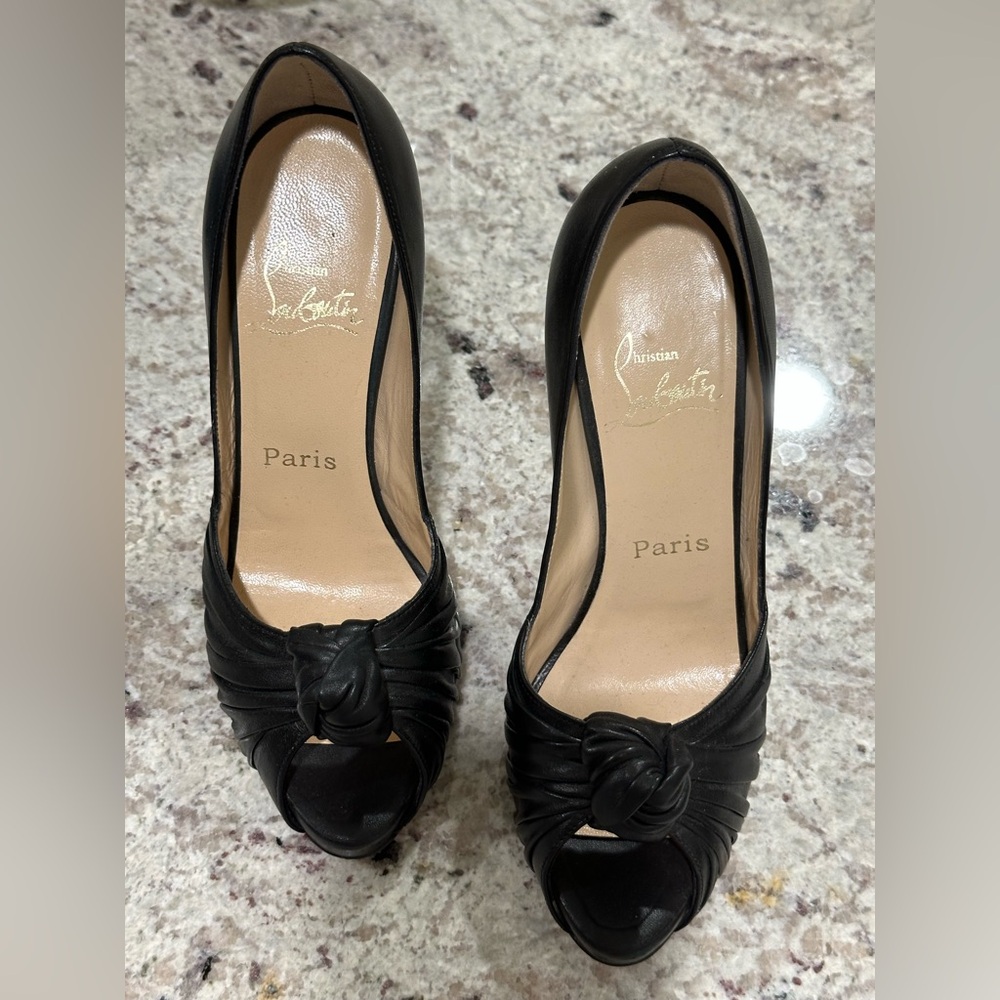 Like new; Christian Louboutin "Greissimo” classic heels; Size 7.5; $900